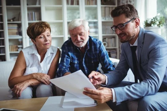 Adviser reviewing documents with clients